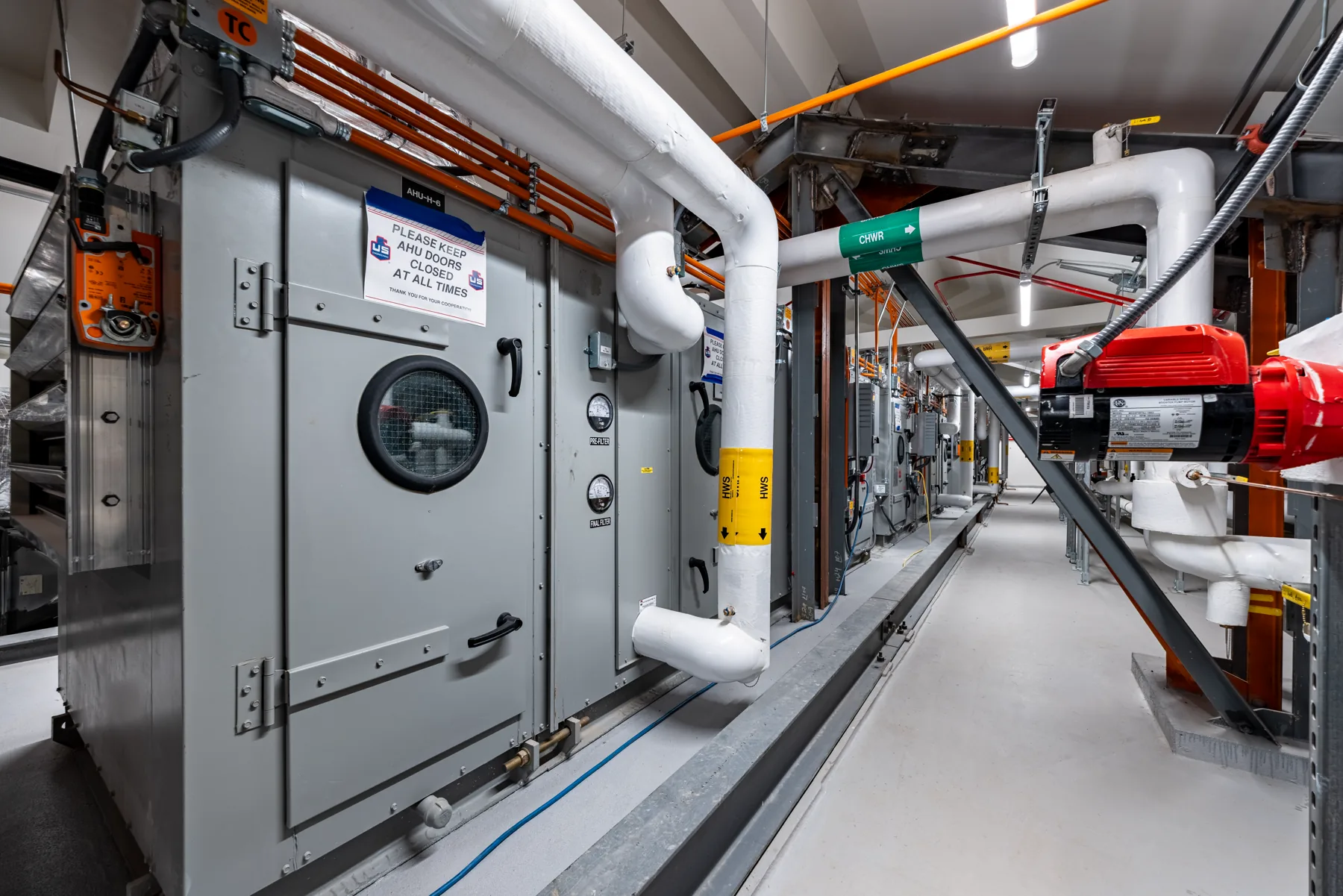 Hellems Hall mechanical room with air handling units and piping, University of Colorado Boulder