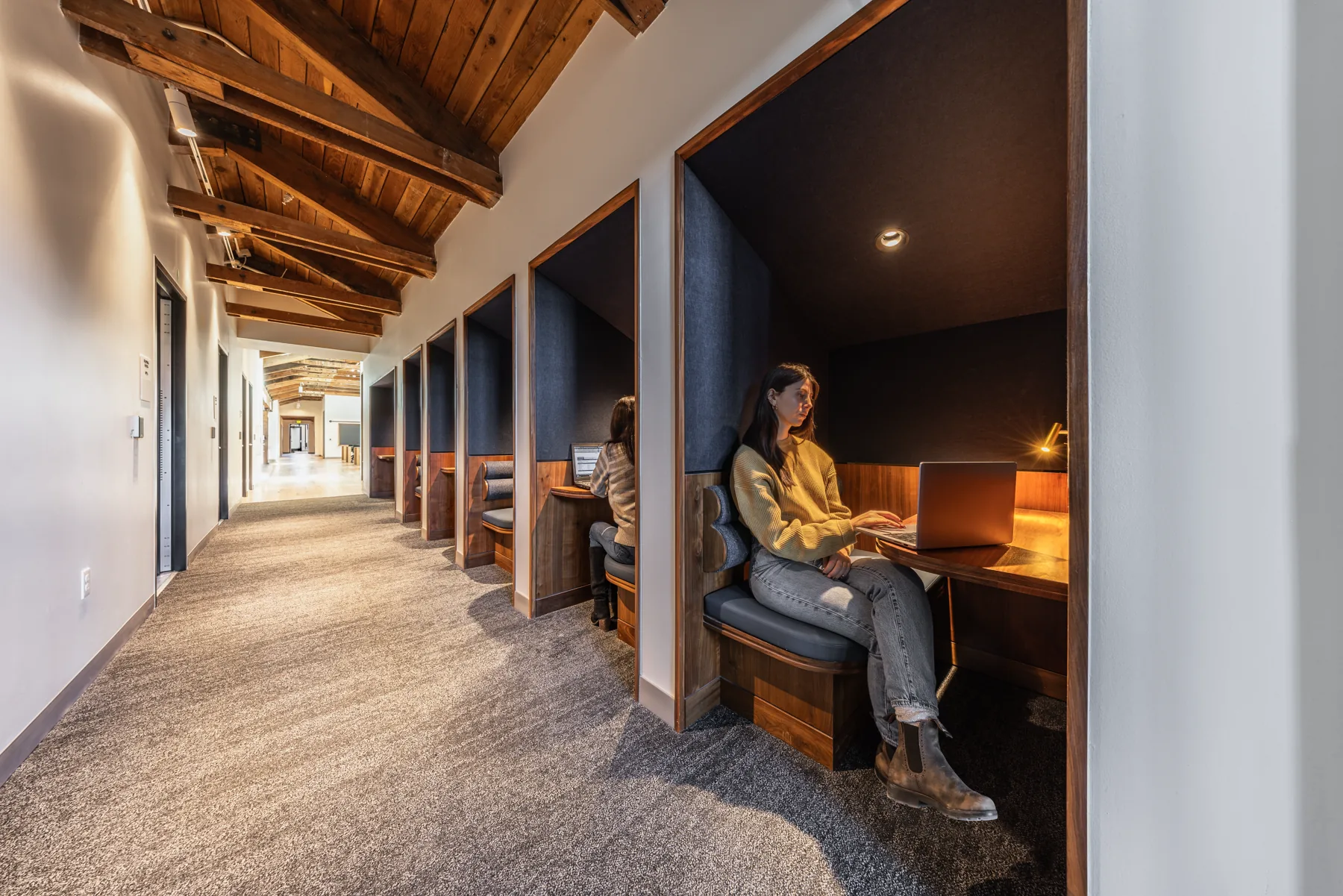Study nooks under an exposed timber ceiling, Hellems Hall, University of Colorado Boulder