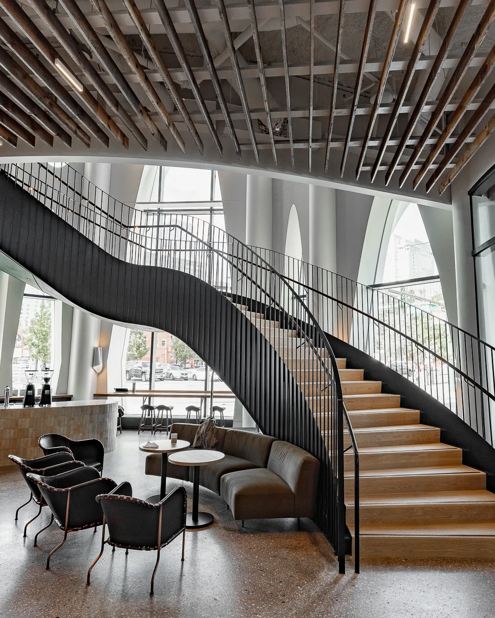 Sculptural curved staircase in a modern office interior