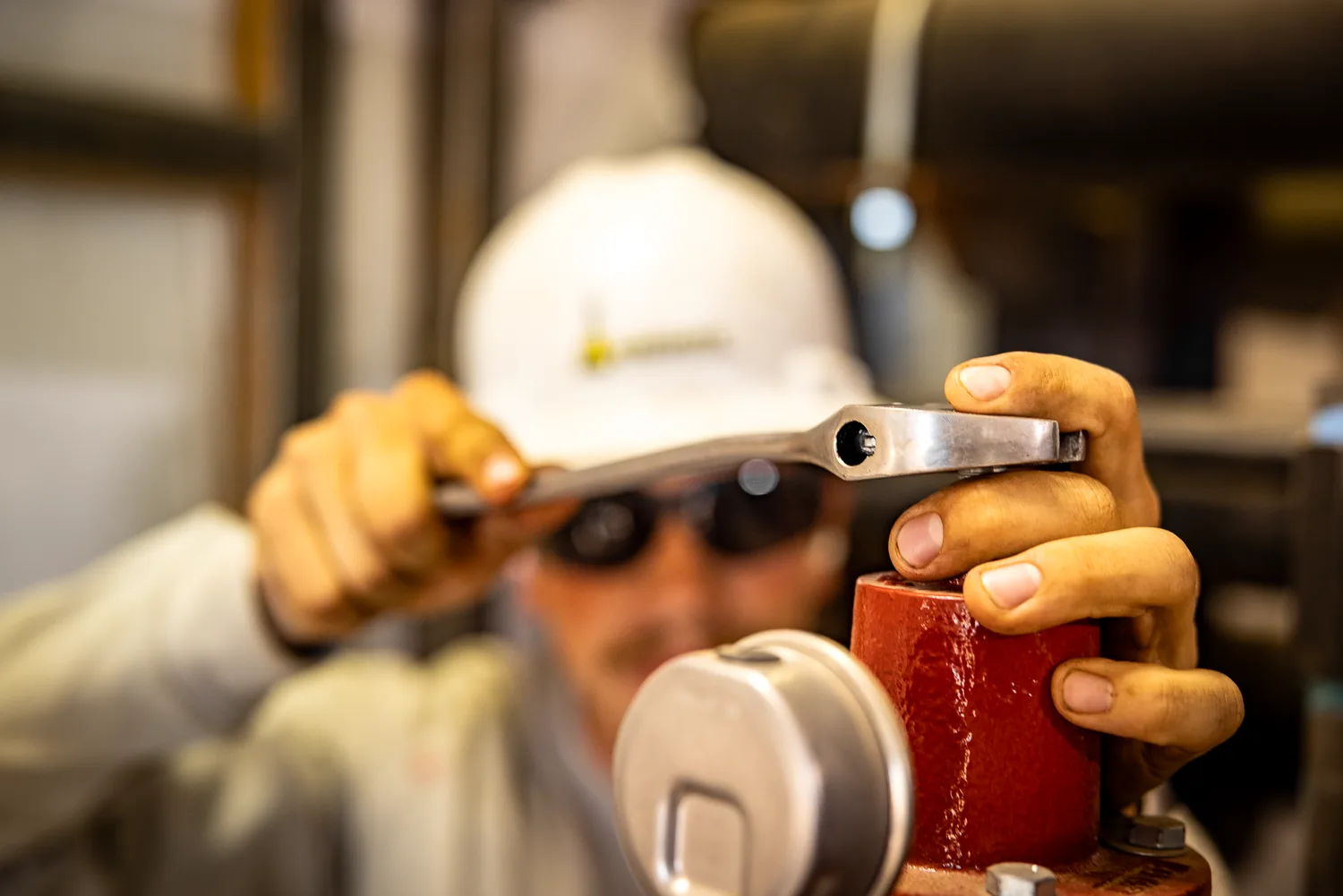 Worker inspecting a tool, close-up