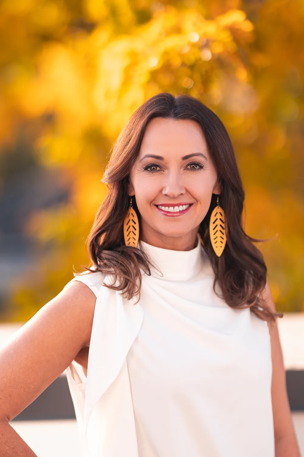 Outdoor portrait against golden fall color