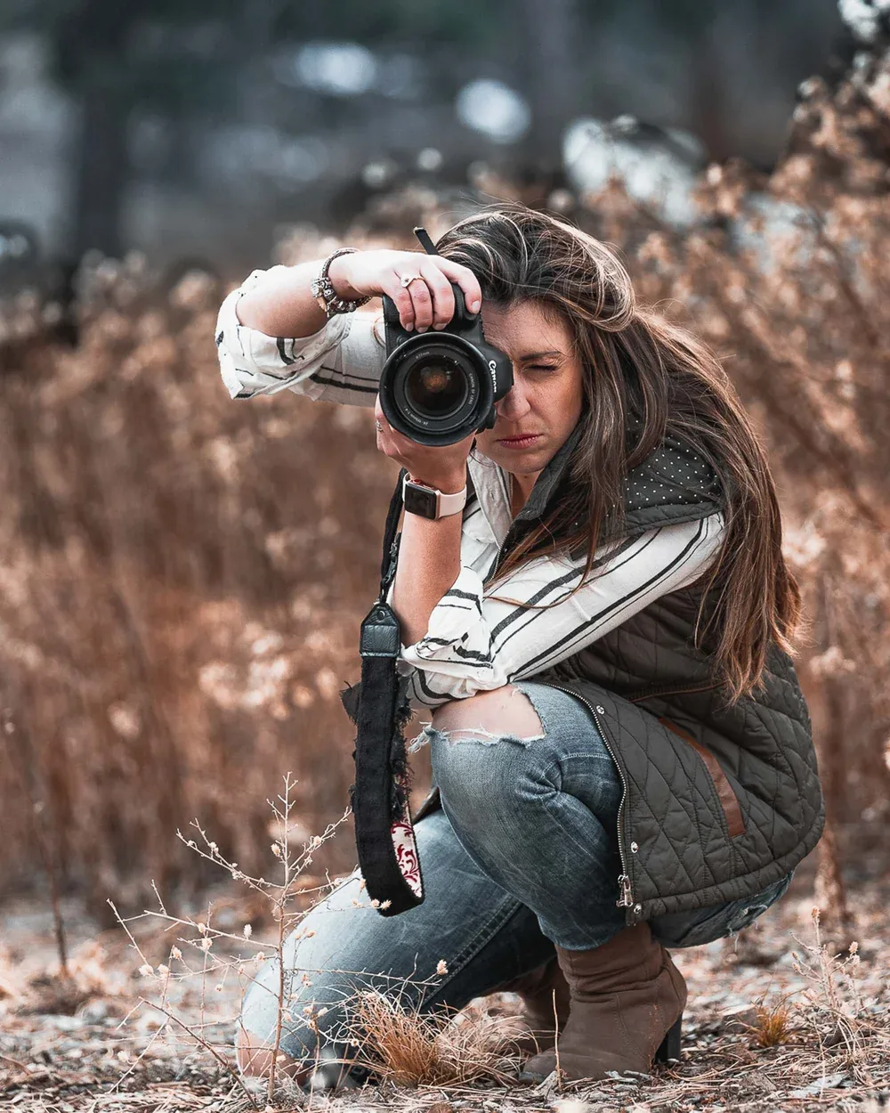Environmental portrait of a photographer working in the field